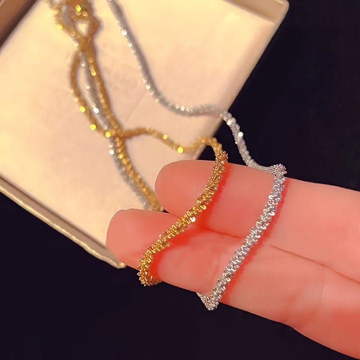 Chic gnistrande smyckesset med armband och halsband