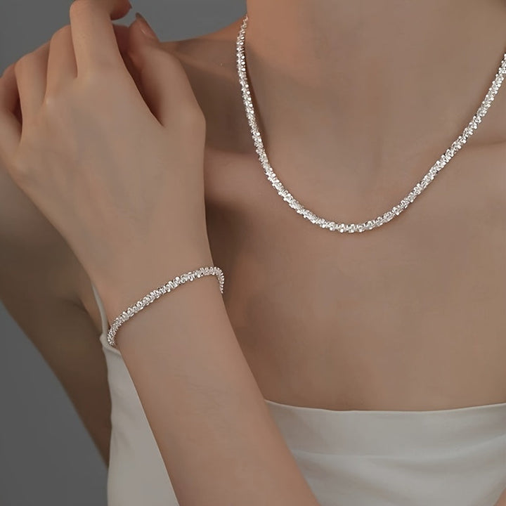 Chic gnistrande smyckesset med armband och halsband