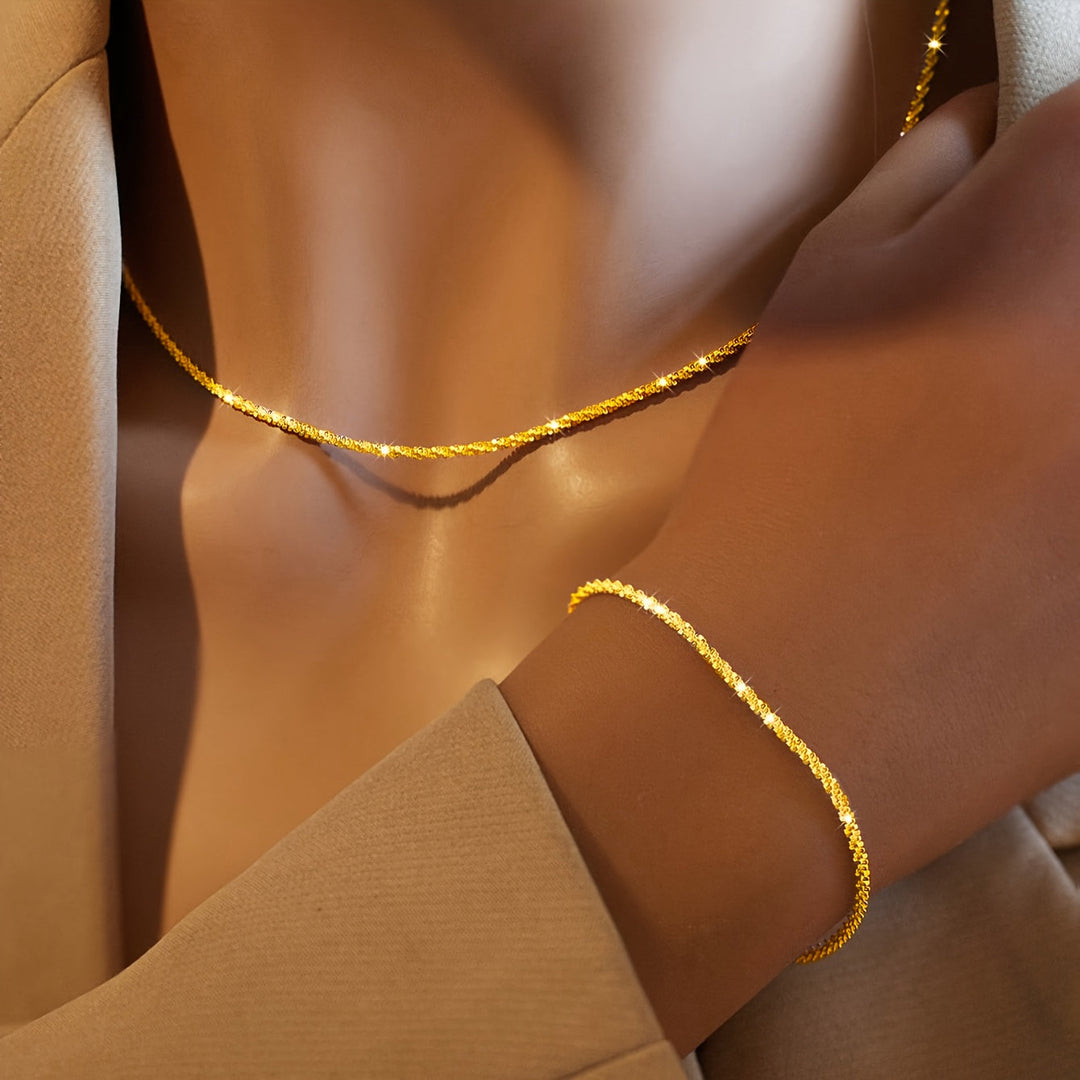 Chic gnistrande smyckesset med armband och halsband