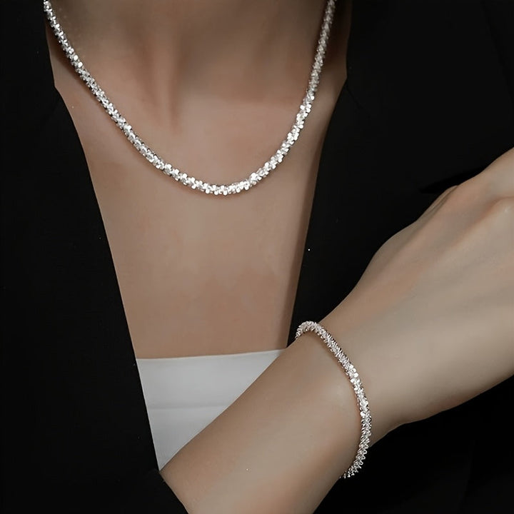 Chic gnistrande smyckesset med armband och halsband
