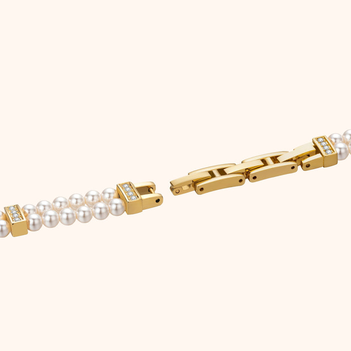 Armbandsur med pärlor och guld