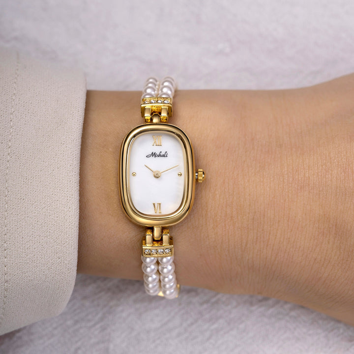 Armbandsur med pärlor och guld