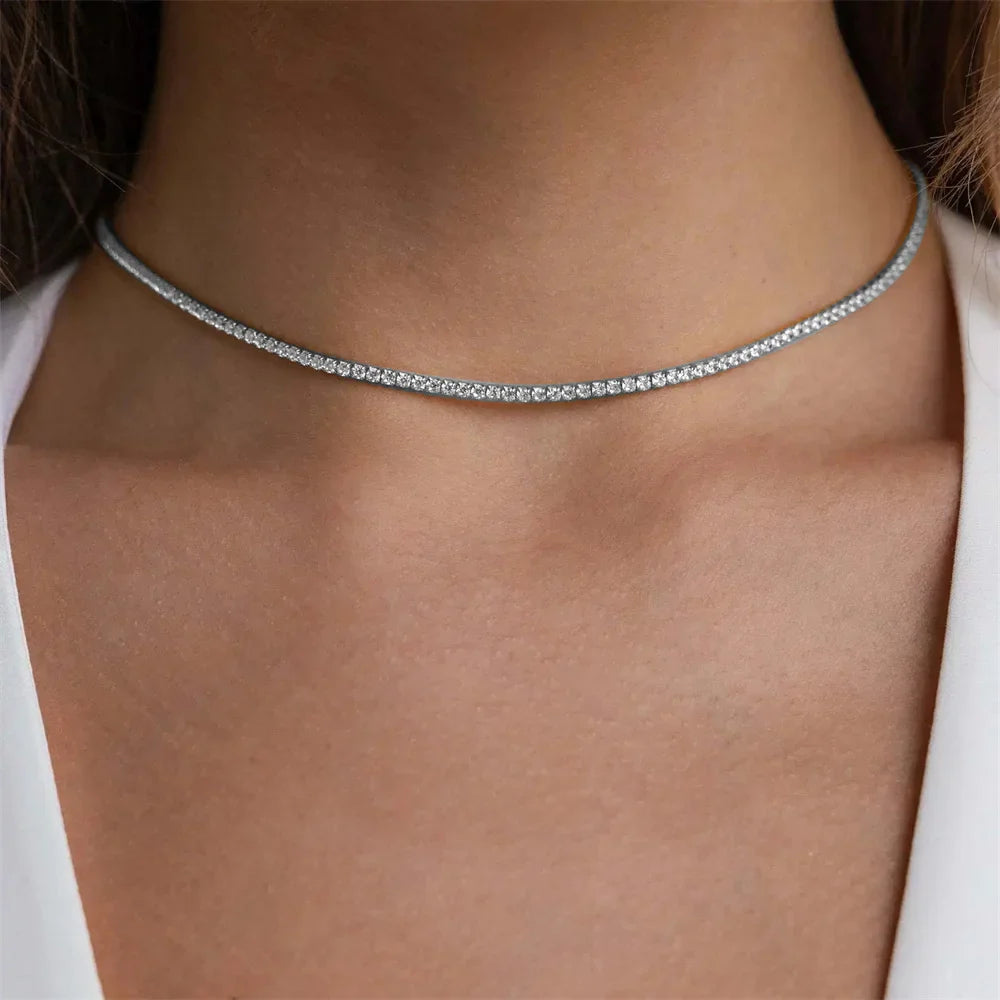 Elegant Guld Rostfritt Stål Tennis Halsband" can be rewritten as "Sleek Gold Stainless Steel Tennis Necklace.