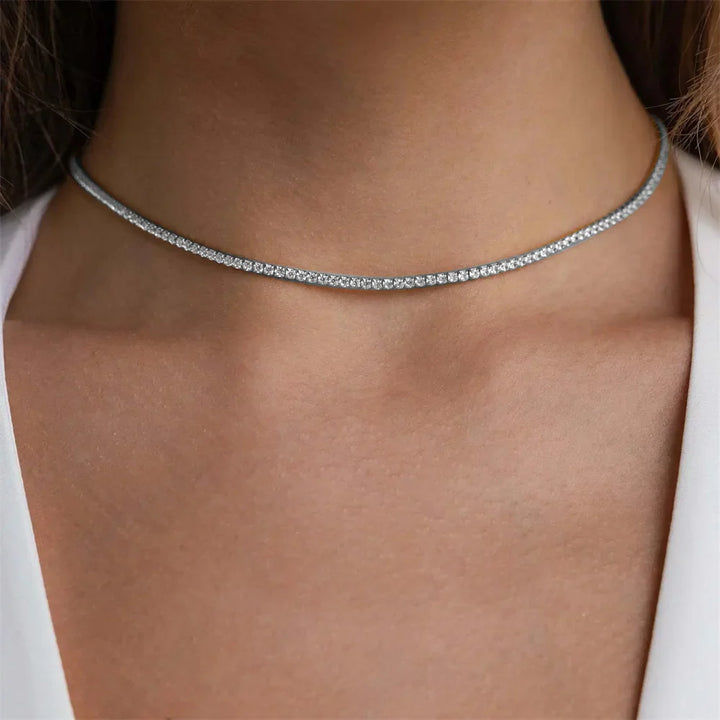 Elegant Guld Rostfritt Stål Tennis Halsband" can be rewritten as "Sleek Gold Stainless Steel Tennis Necklace.