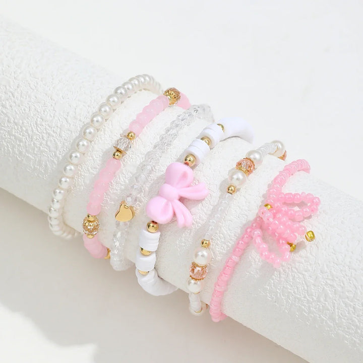 Set med Armband i Pärlälskande Båge