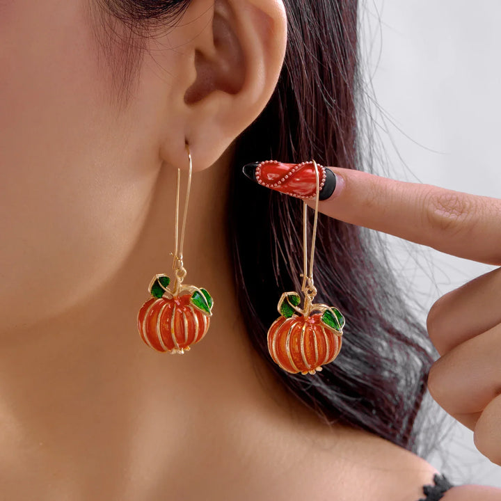 Halloween Pumpa Godis Örhängen" can be rewritten as "Pumpkin Candy Earrings for Halloween.