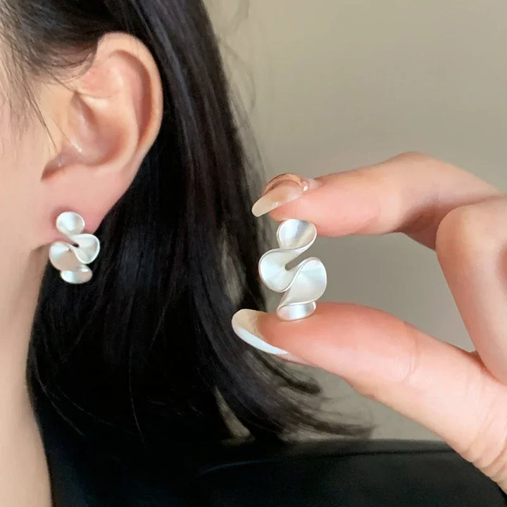 Örhängen i sterlingsilver med 18K guldbelagda blomdetaljer