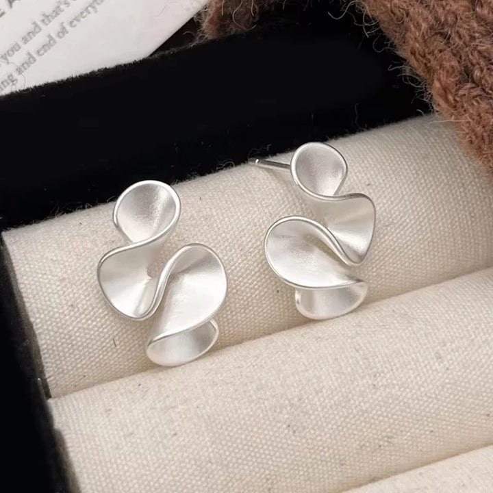 Örhängen i sterlingsilver med 18K guldbelagda blomdetaljer