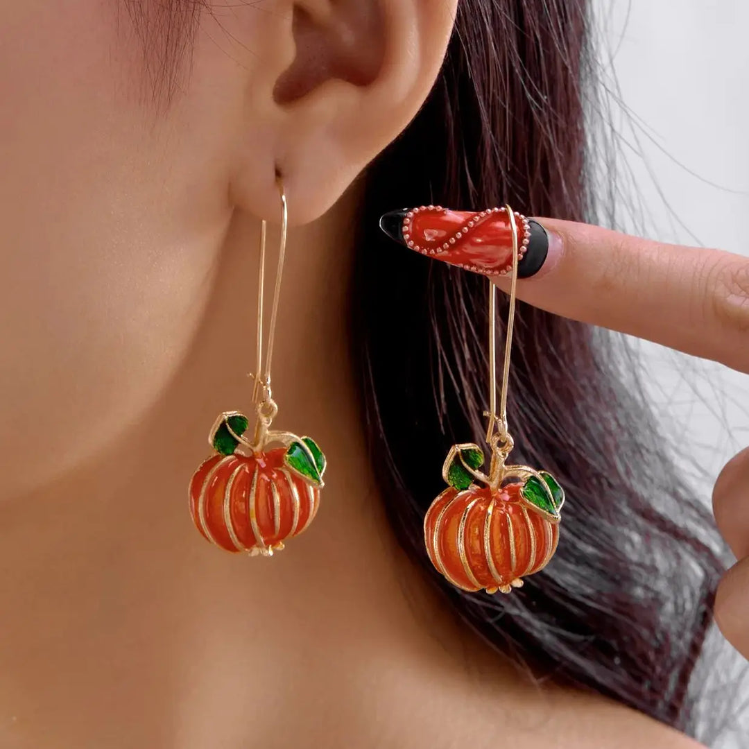 Halloween Pumpa Godis Örhängen" can be rewritten as "Pumpkin Candy Earrings for Halloween.
