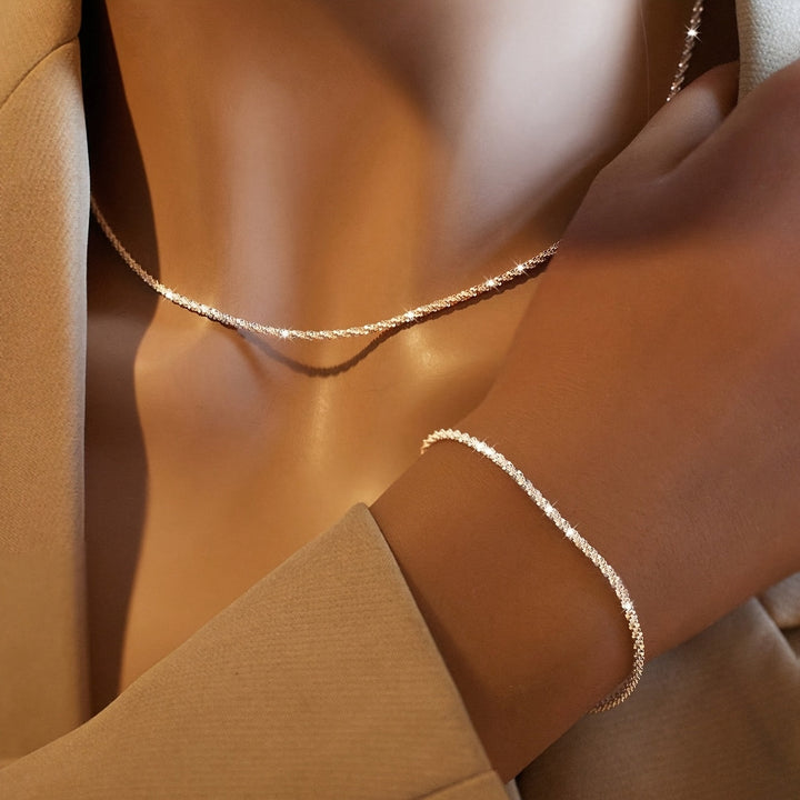 Chic gnistrande smyckesset med armband och halsband
