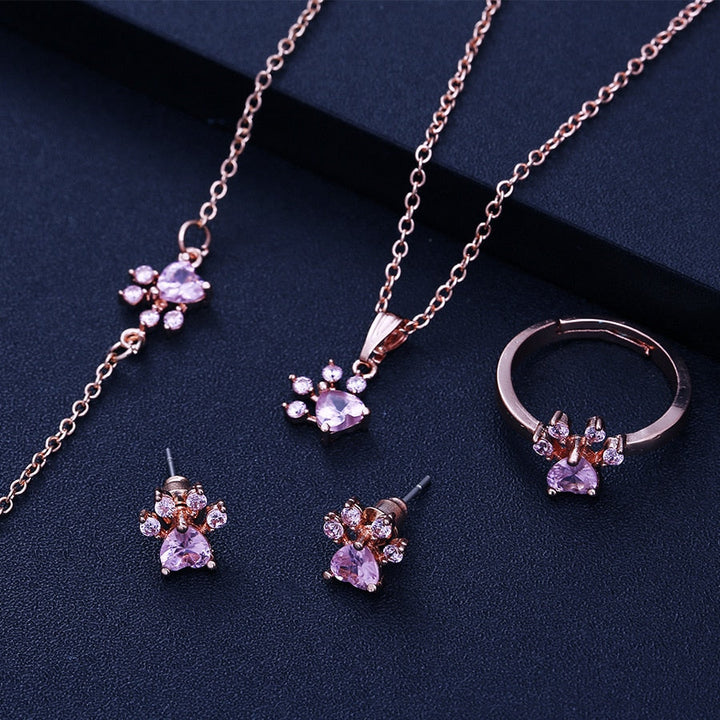 Roséguld Paws Smyckeset – 4 Delar med Zirkonia Hjärta" can be rewritten as:

"Roséguld Paws Smyckeset – 4 Delar med Zirkonia-Hjärta